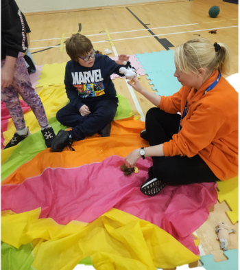 child playing with parachute