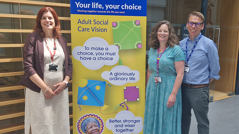 Bexley staff standing in front of a your life, your choice sign