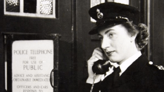 Image of female police officer on the telephone