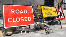 image shows roadwork signs