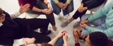 Group of adults sitting around in a circle